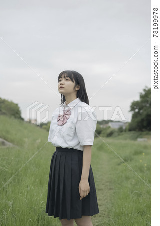 School girls looking up at the sky School girls looking up at the sky 78199978