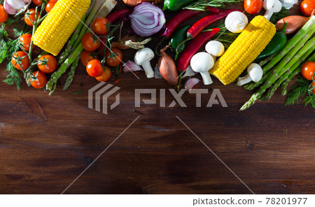 Wooden background with vegetables, mushrooms, greens Wooden background with vegetables, mushrooms, greens 78201977