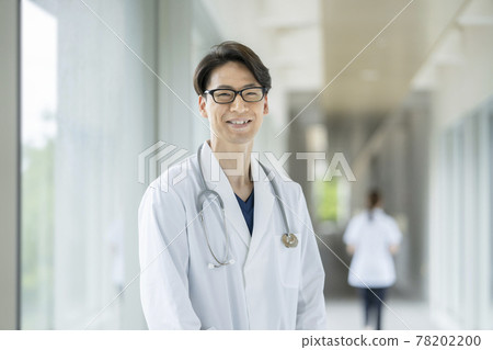 Portrait of a smiling male doctor looking at the camera Portrait of a smiling male doctor looking at the camera 78202200