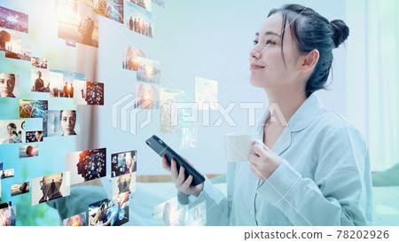 Women watching videos on their smartphones Digital content 78202926