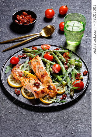 grilled salmon fillets with lemon, bacon,vegetables grilled salmon fillets with lemon, bacon,vegetables 78203003
