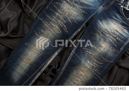 Glamorous womens fashion a jeans in rhinestones. Top view. Glamorous womens fashion a jeans in rhinestones. Top view. 78205483