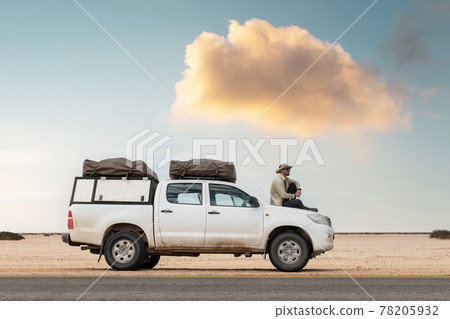 A tourist sits in his SUV A tourist sits in his SUV 78205932