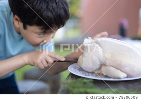 Children enjoying outdoor cooking Children enjoying outdoor cooking 78206509