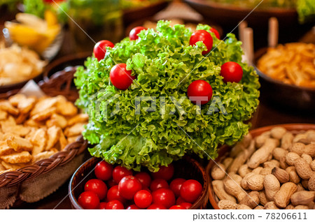 Snack with tomatoes and lettuce and nuts Snack with tomatoes and lettuce and nuts 78206611