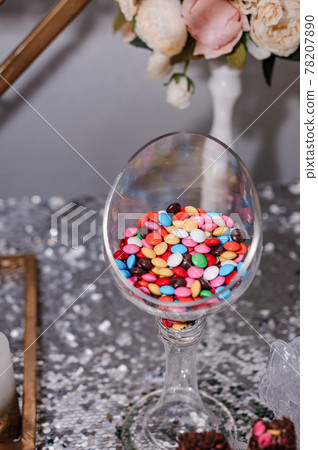 Sweet cakes at a wedding banquet. Catering, sweet festive buffet. Candy bar Sweet cakes at a wedding banquet. Catering, sweet festive buffet. Candy bar 78207890