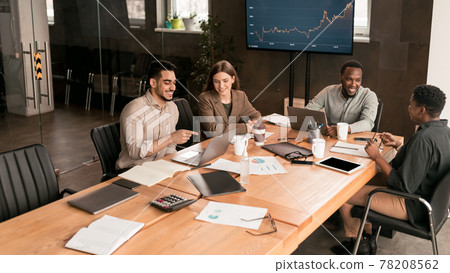 Colleagues having meeting in boardroom, working on startup Colleagues having meeting in boardroom, working on startup 78208562