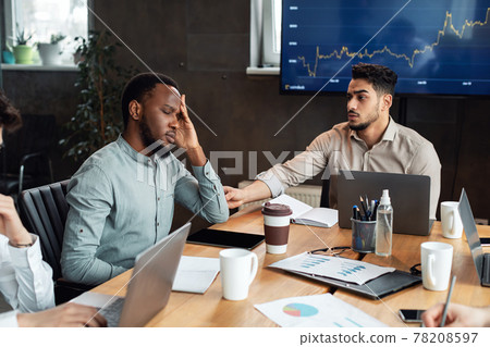 Sick young black male worker suffering from headache 78208597