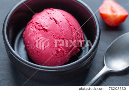 Fruity ice cream scoop on plate 78208880