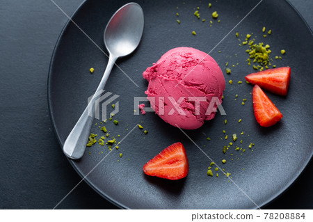 Fruity ice cream scoop on plate 78208884