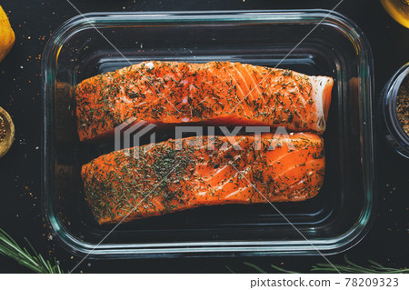Raw salmon with spices on pan Raw salmon with spices on pan 78209323