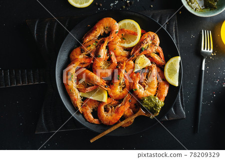 Shrimps with spices on plate 78209329