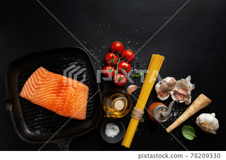 Raw salmon with spices on dark Raw salmon with spices on dark 78209330