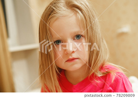 Close up portrait of a little blonde girl on a summer day 78209809