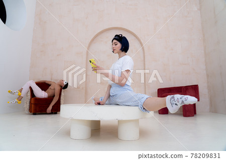 Couple in pajamas resting at home by creative way. Concept of relationship, creativity and individuality 78209831