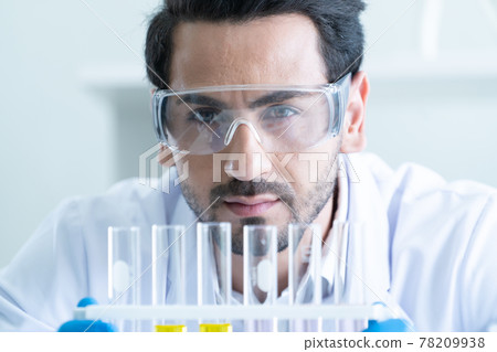 Male Scientist Looking Vaccine 78209938