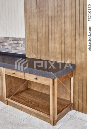 Furniture of toned ash timber in cookhouse on open terrace Furniture of toned ash timber in cookhouse on open terrace 78210189