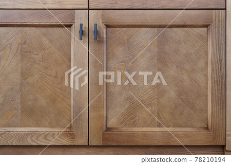 Cabinet facade with closed doors made of solid ash timber 78210194