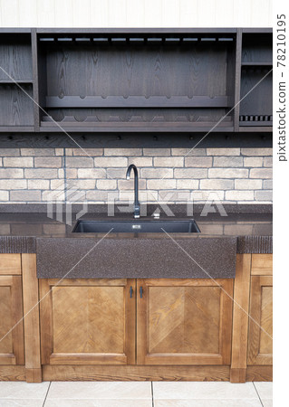 Comfortable summer kitchen with ash furniture and new sink 78210195