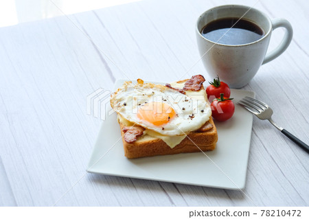 Toast fried egg open sandwich coffee white table 78210472