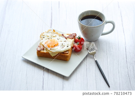 Toast fried egg open sandwich coffee white table Toast fried egg open sandwich coffee white table 78210473