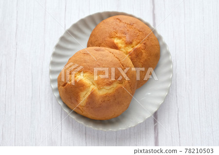 A sweet meal for a snack, a white plate, a bird's-eye view, right above A sweet meal for a snack, a white plate, a bird's-eye view, right above 78210503