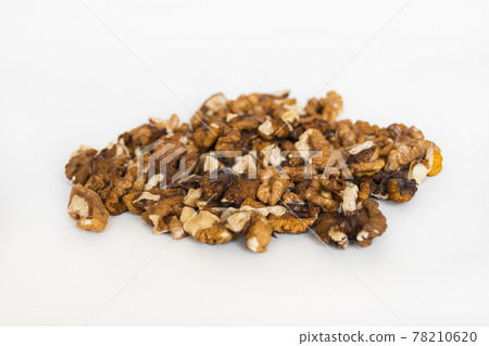 Walnuts isolated on white background, selective focus Walnuts isolated on white background, selective focus 78210620