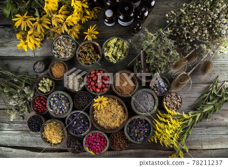 Natural remedy and wooden table background 78211237
