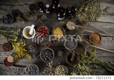 Natural remedy, mortar and herbs Natural remedy, mortar and herbs 78211272