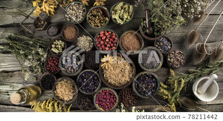Fresh medicinal herbs on wooden background 78211442
