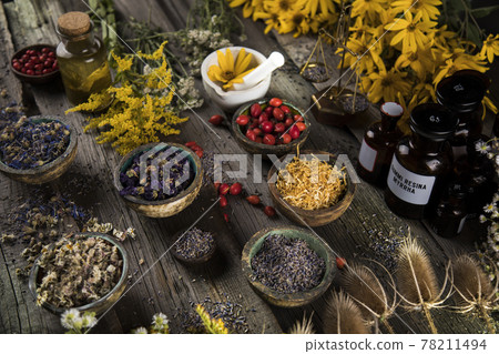 Fresh medicinal herbs on wooden background Fresh medicinal herbs on wooden background 78211494