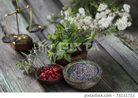 Fresh medicinal herbs on wooden background 78211722