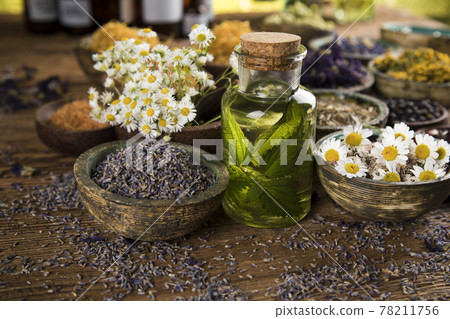 Oil and Natural medicine, wooden table background Oil and Natural medicine, wooden table background 78211756