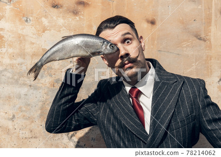 Half-length portrait of young actor in the image of greatest painter, artist isolated on light background. 78214062