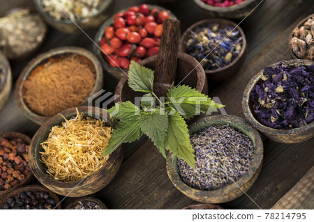Natural remedy and wooden table background Natural remedy and wooden table background 78214795