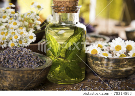 Oil and Natural medicine, wooden table background 78214893