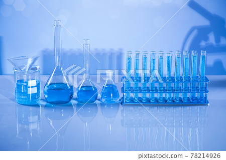 Laboratory beakers,Science experiment, blue background 78214926