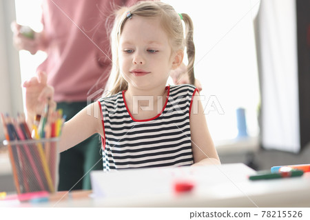Little girl takes out pencil for drawing 78215526