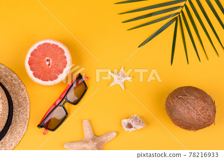 Beach accessories with shells and sea stars on a colored background Beach accessories with shells and sea stars on a colored background 78216933