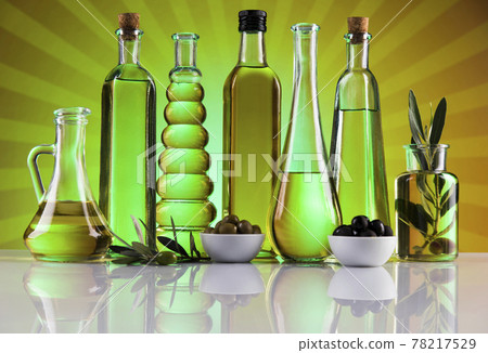 Bottles of olive oil, olive branch and Cooking oils Bottles of olive oil, olive branch and Cooking oils 78217529