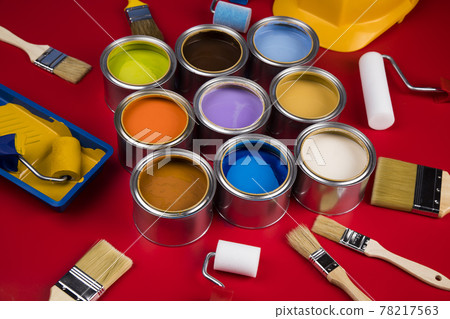 Metal tin cans with color paint and paintbrush 78217563