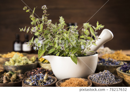 Natural remedy, mortar and herbs 78217632