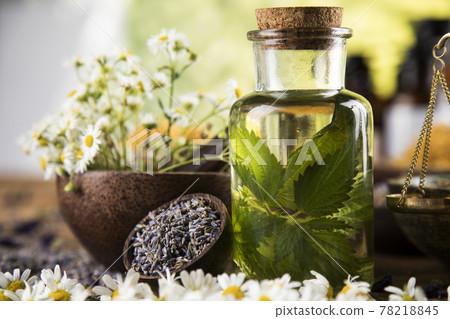 Oil and Natural medicine, wooden table background 78218845