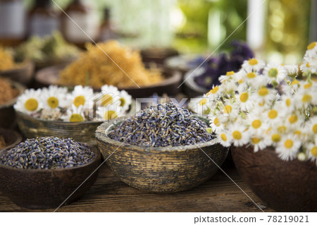 Homeopathy, herbal medicine on wooden table , black mirror background 78219021