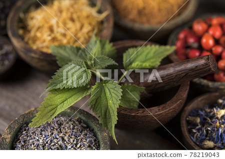Natural remedy and wooden table background Natural remedy and wooden table background 78219043