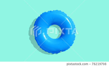 Blue inflatable swimming pool ring on blue background. 78219708