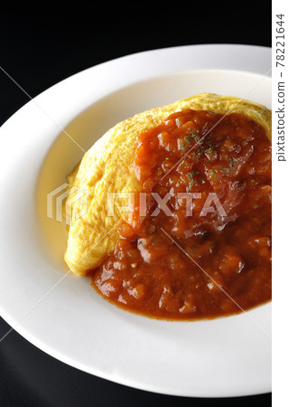 Shoot omelet rice or omelet with meat sauce on a black background 78221644