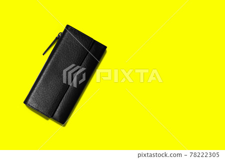 Fashionable leather women's wallet on a yellow background. added copy space for text. 78222305