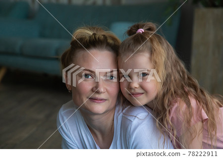 Portrait of mother with daughter in sportswear hugging Portrait of mother with daughter in sportswear hugging 78222911