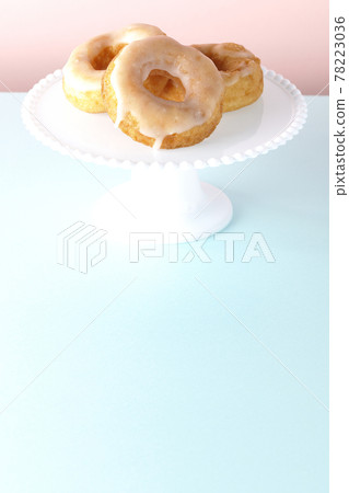 Honey glaze donuts served on a cake stand Honey glaze donuts served on a cake stand 78223036